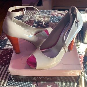 I only wore it to a friends wedding. They are practically new